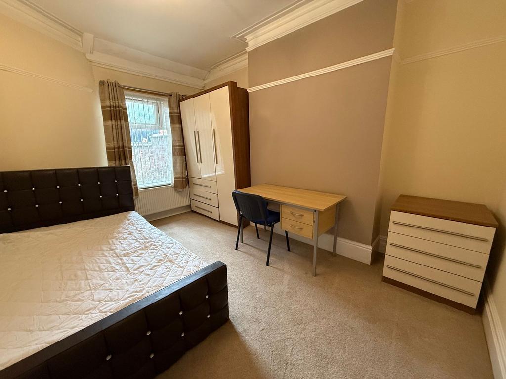 Bright, neatly presented bedroom with a double ...