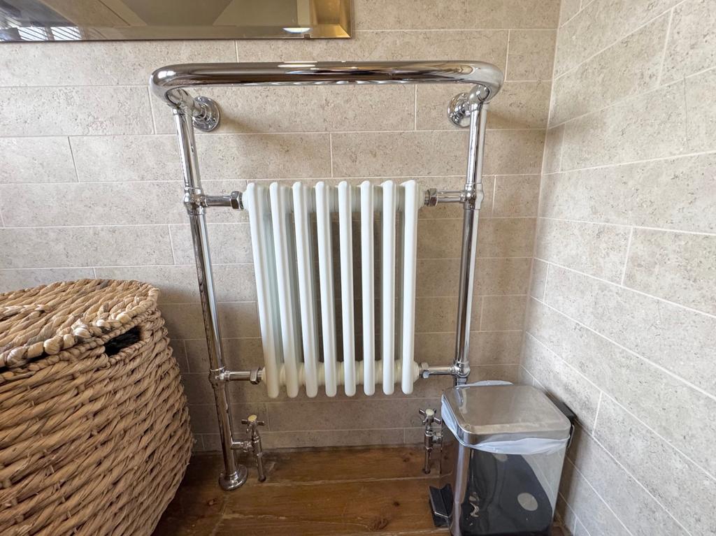 Heated towel rail and radiator