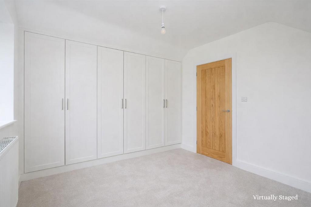 Bedroom two with wardrobes