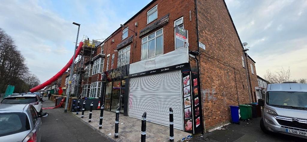 Corner shopfront on a brick terraced building...
