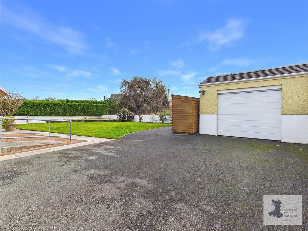 Drive, garage and rear garden