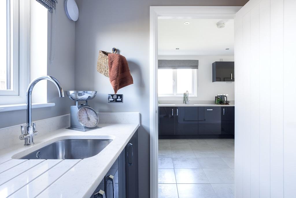 The utility room offers extra storage space
