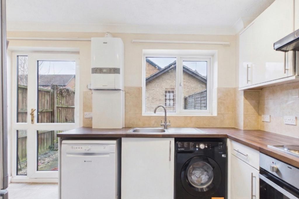 A bright and airy kitchen space with a lovely view