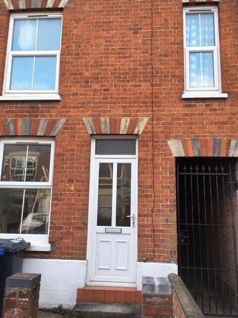 Traditional red-brick terraced house frontage w...
