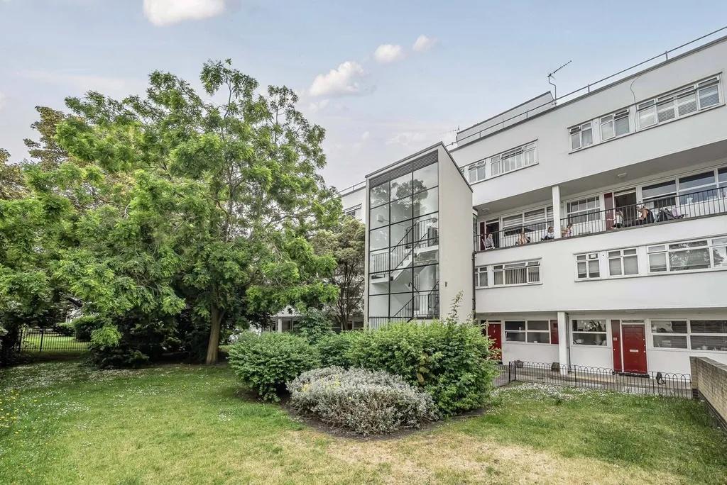 Well‑kept communal green and modern block front...
