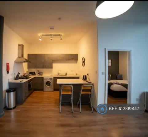 Kitchen And Entrence To Room.