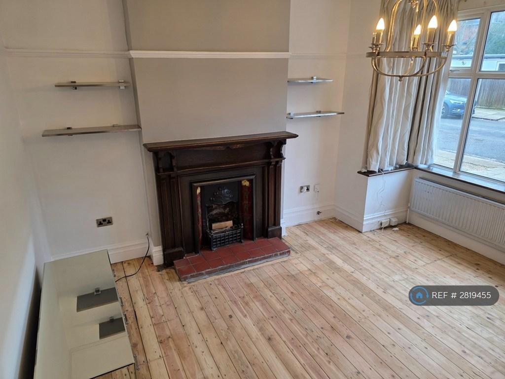 Living Room With Large Bay Window And Fireplace