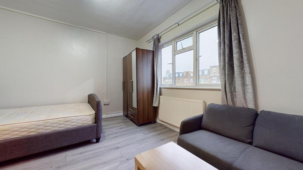 Bright furnished bedroom with a comfortable sin...
