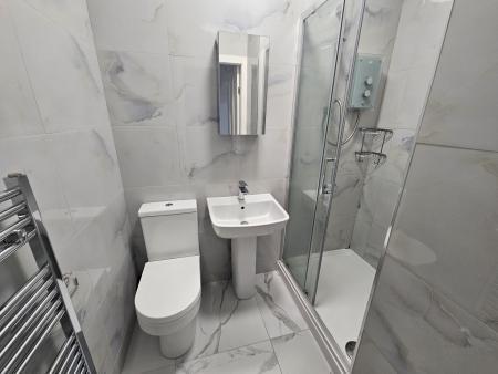 Bright and modern bathroom featuring a sleek wa...
