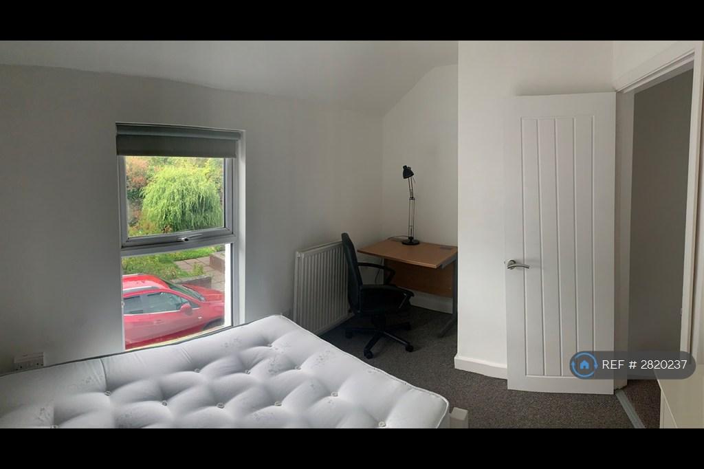 Front Bedroom With Desk And Chair