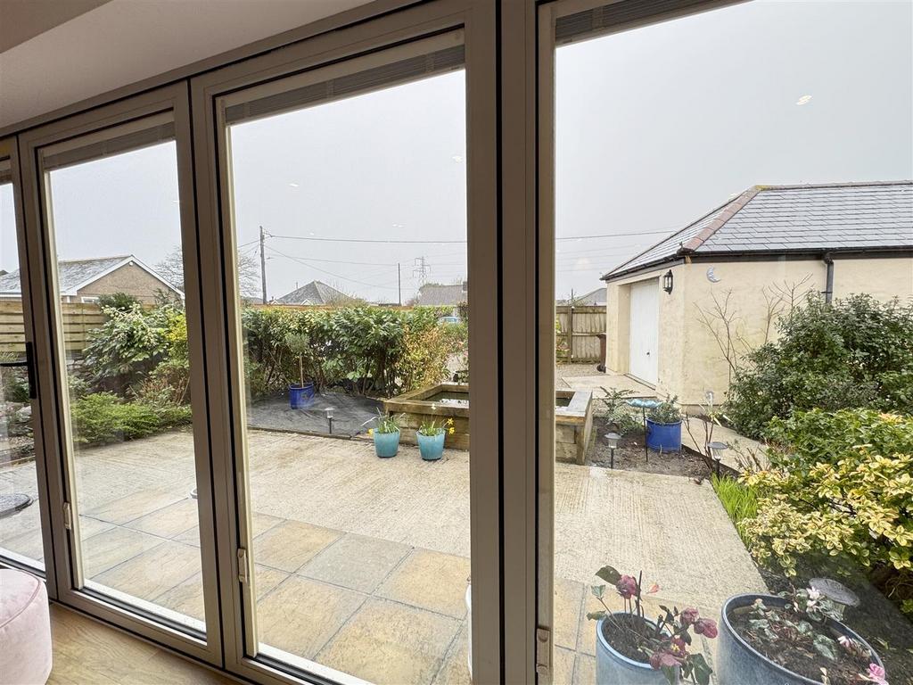 Tri-Fold doors to front Garden