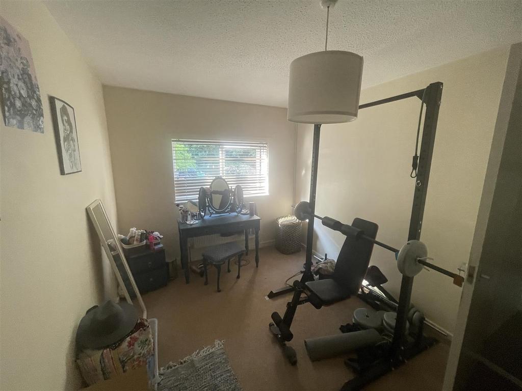 Bright bedroom with study desk and gym corner...