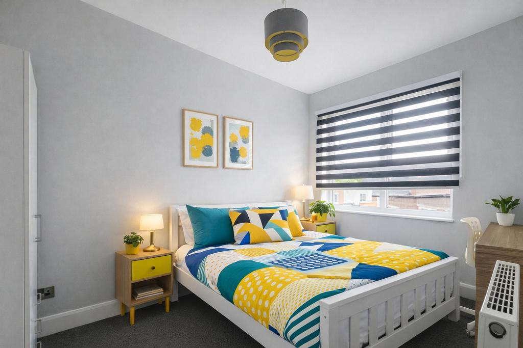 Bright, modern double bedroom with a colorful d...