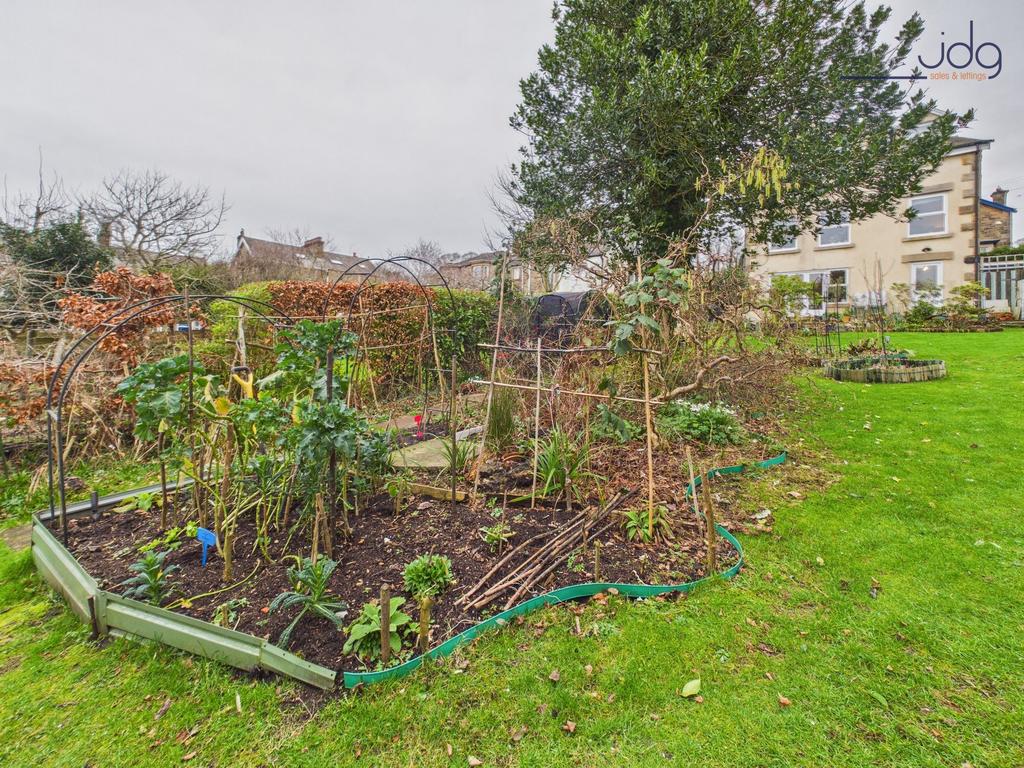Mature landscaped garden with vegetable and...