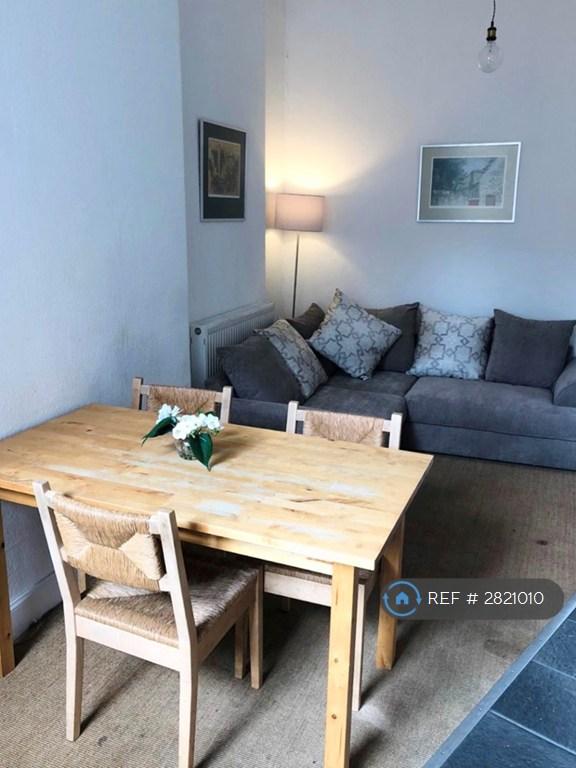 Stylish Kitchen With Dining Table &amp; Lounge Area