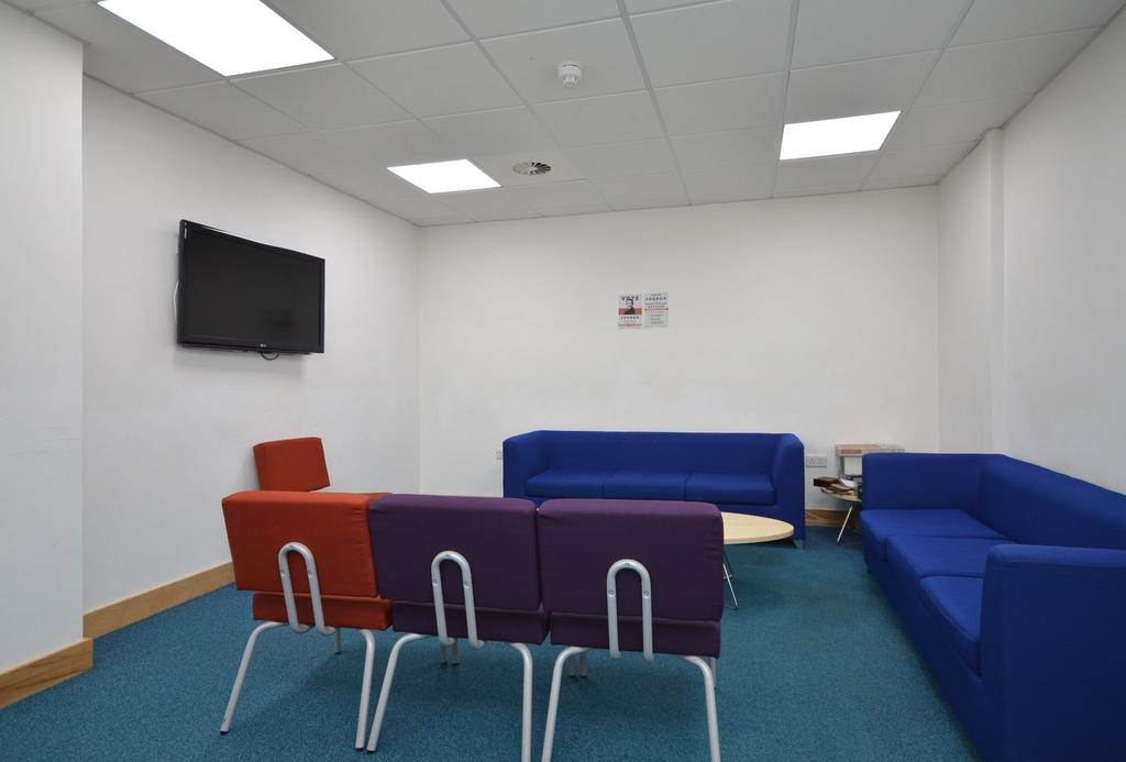 Bright communal lounge with comfy seating...