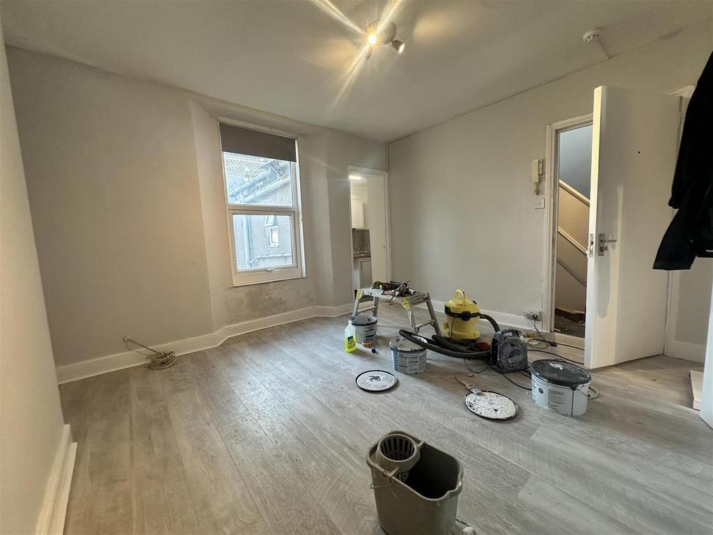 Bright room with bay window and neutral floorin...