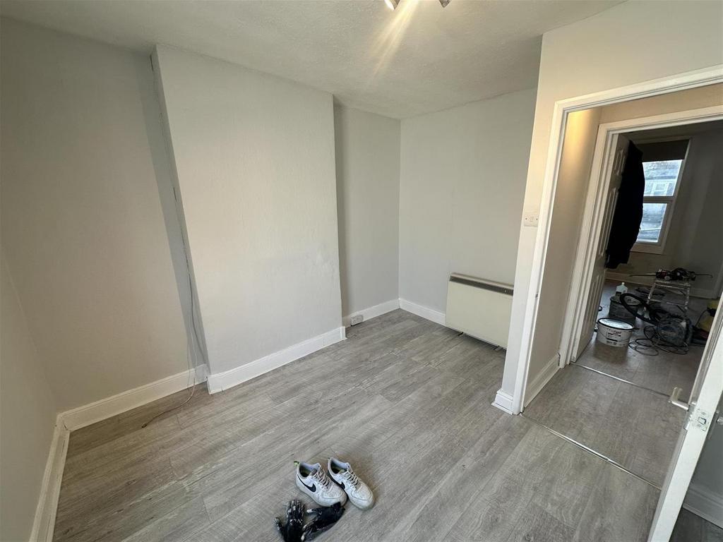 Clean, neutral single room with new flooring...