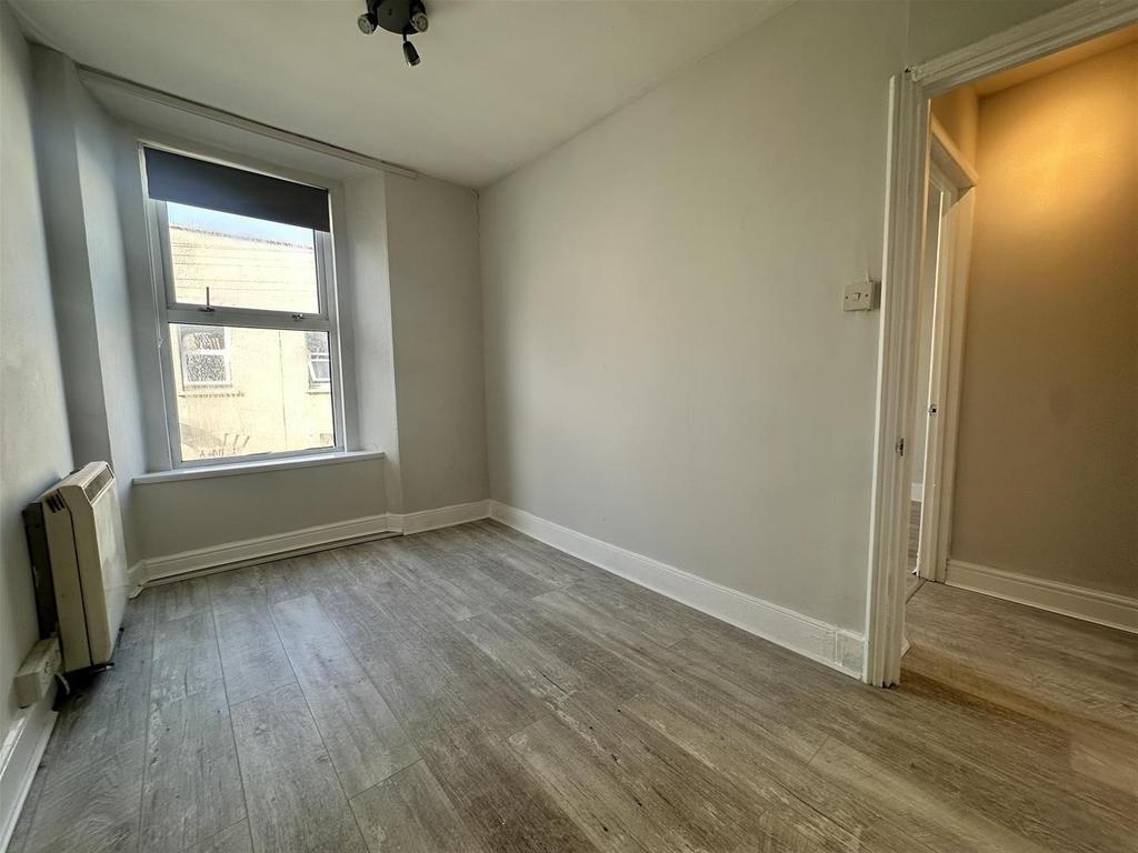 Bright room with bay window and wood floors...
