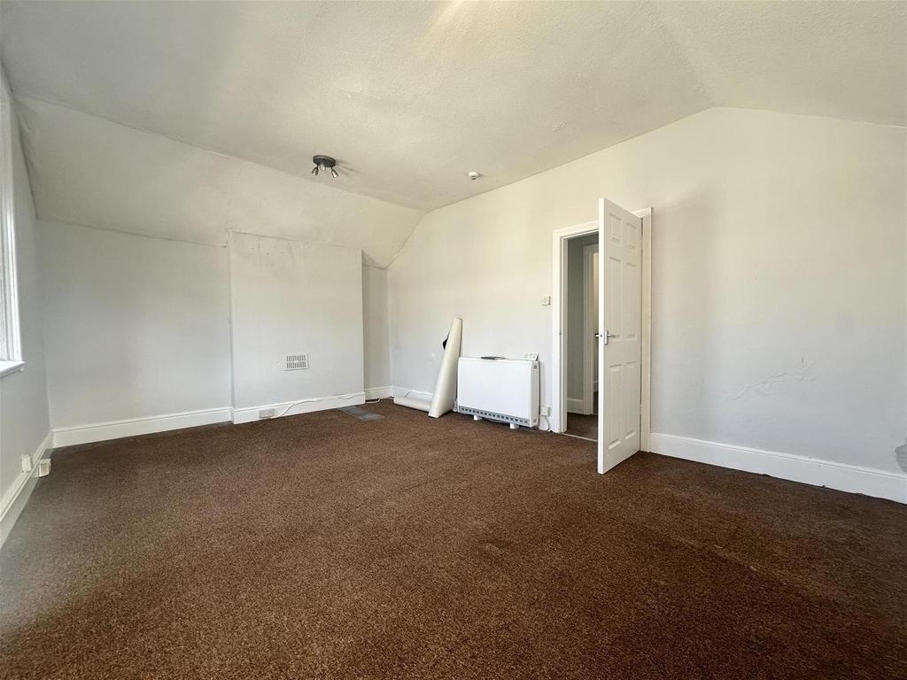 Spacious bright bedroom with high ceilings...