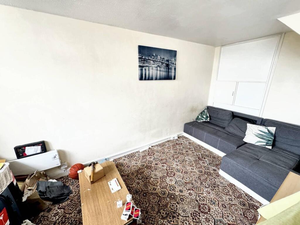 Cozy lounge with corner sofa and patterned rug...