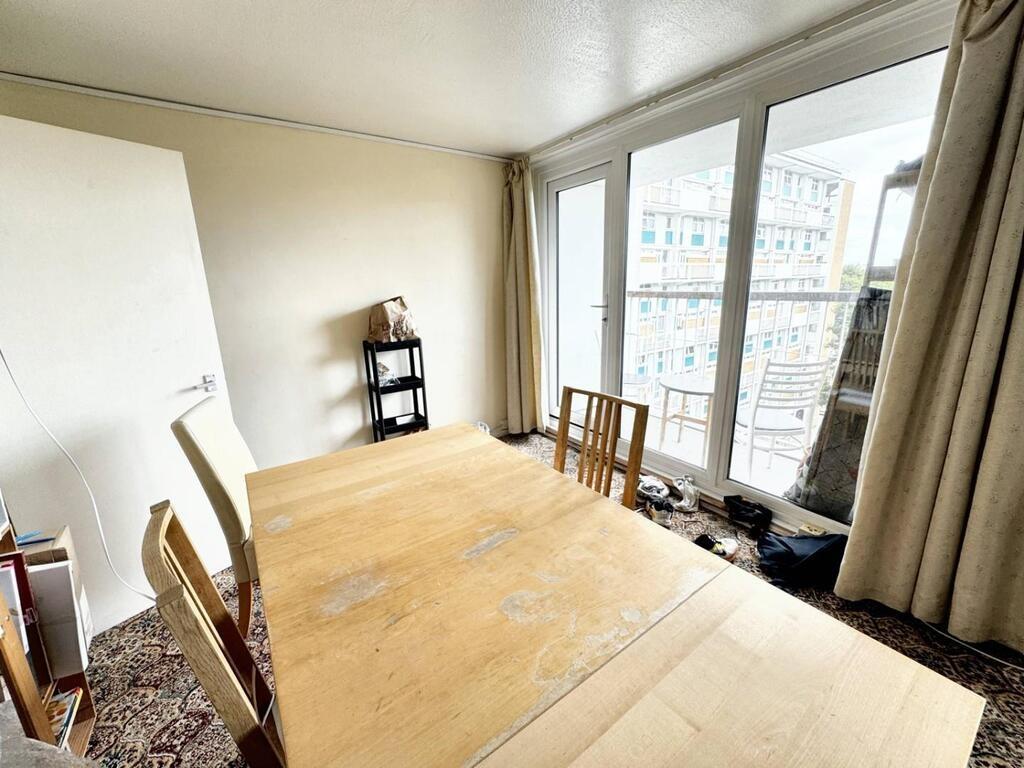 Bright dining area with large windows...