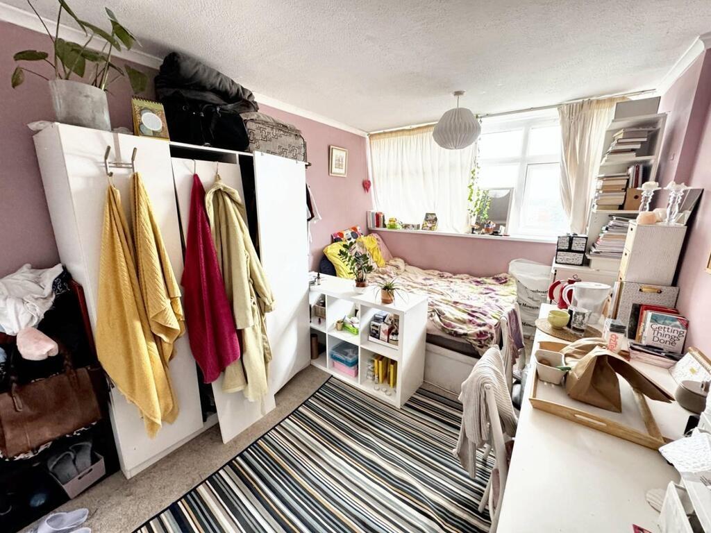 Bright furnished bedroom with lots of storage...