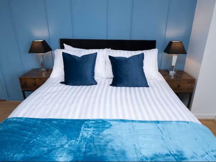 Bright, neatly styled bedroom featuring a doubl...
