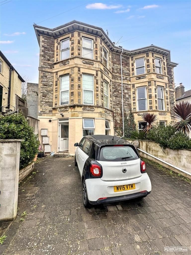Attractive stone-fronted house with driveway an...