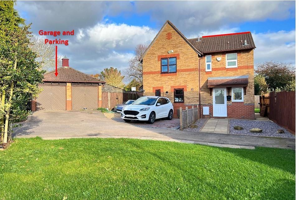 Left hand garage &amp; parking and right hand house an