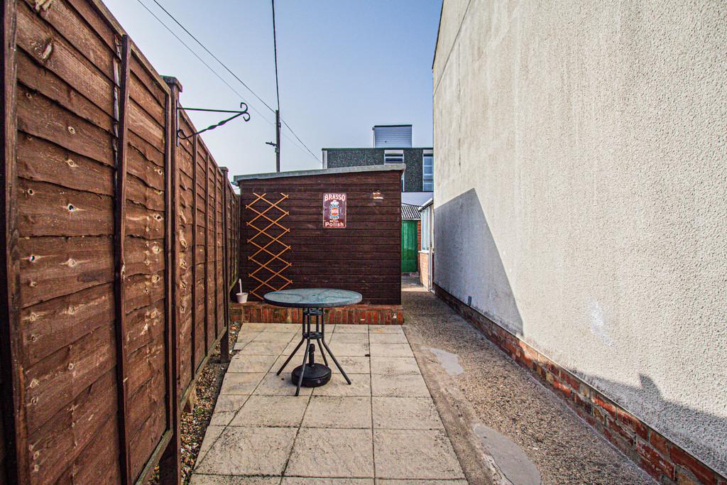 Side garden with wooden shed