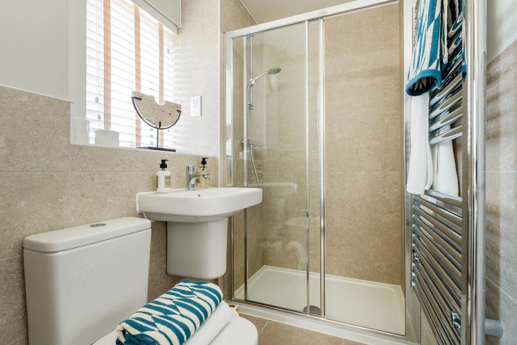 Bedroom 1 also features a private en suite...