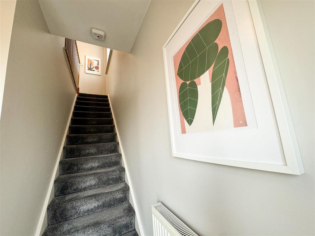 Stairs rising to first floor