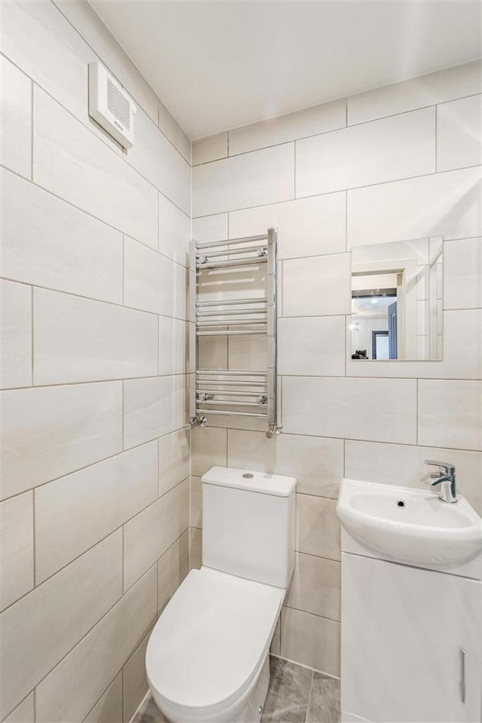 Bright tiled bathroom with modern fixtures...