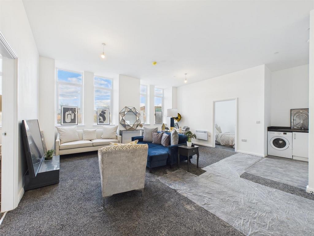 Bright, modern open-plan living space with larg...