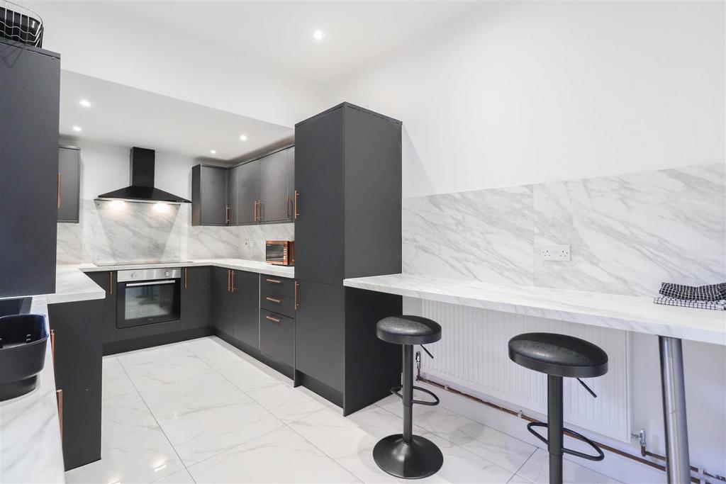 Modern fitted kitchen with breakfast bar...