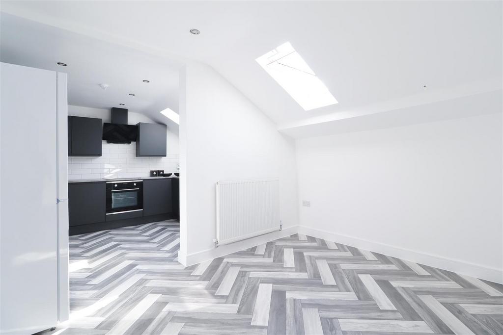 Bright open-plan living area with modern kitche...