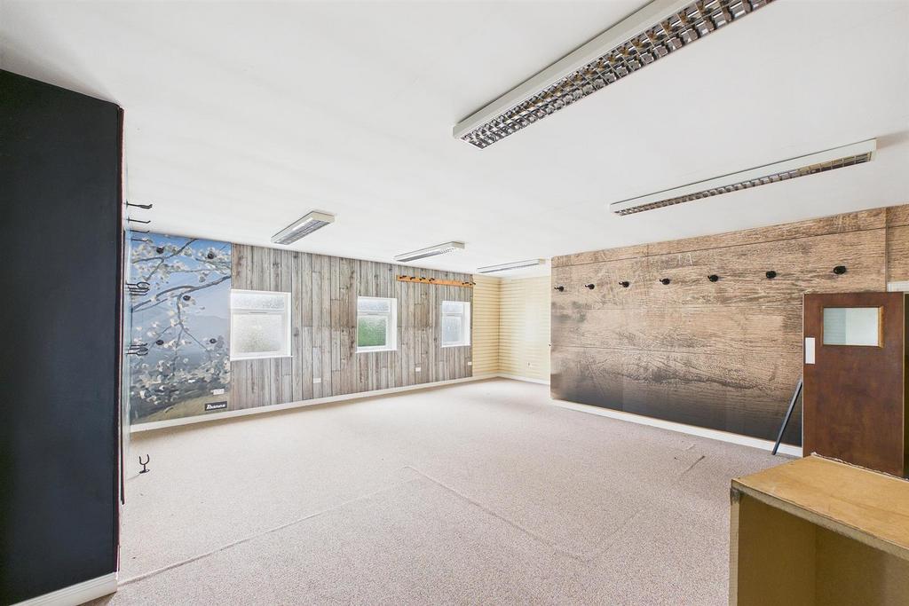 Bright, flexible communal workspace with large ...