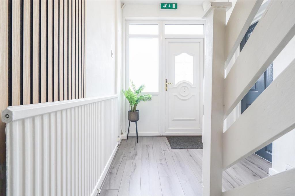 Bright, welcoming entrance hall with contempora...