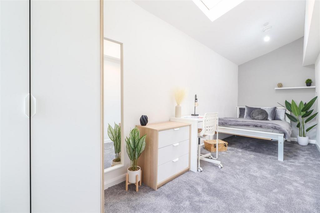 Bright, modern bedroom with study area...