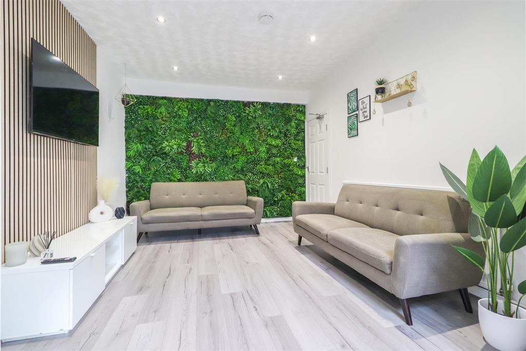 Bright, modern living room with two comfortable...
