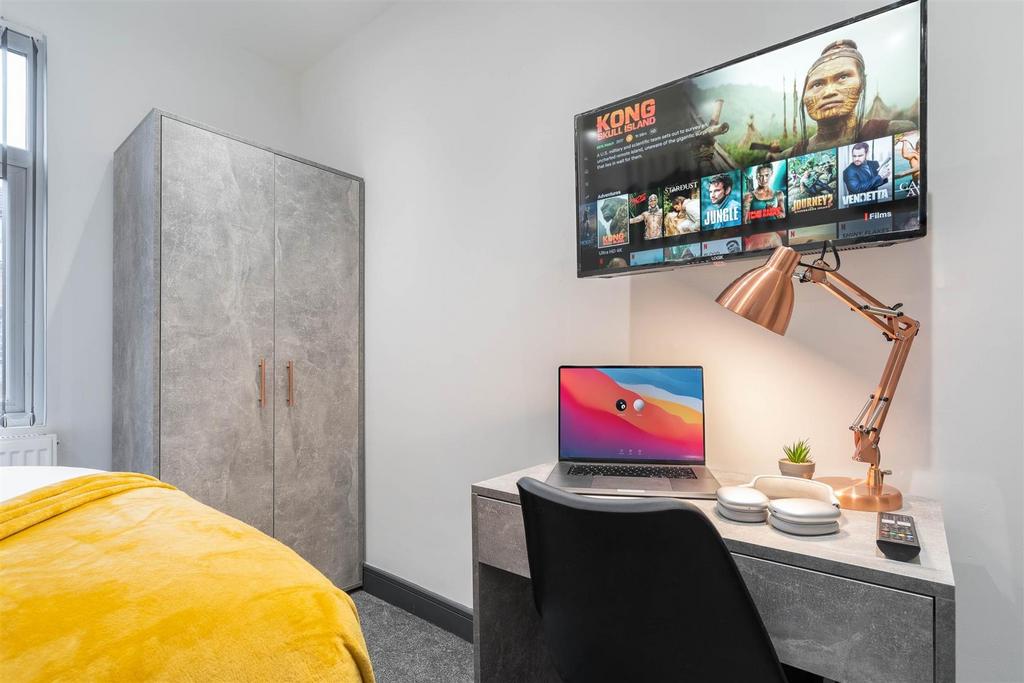 Bright, tidy bedroom with desk and wardrobe...