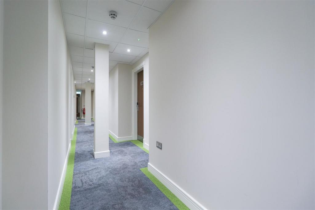 Bright modern communal corridor with clean deco...