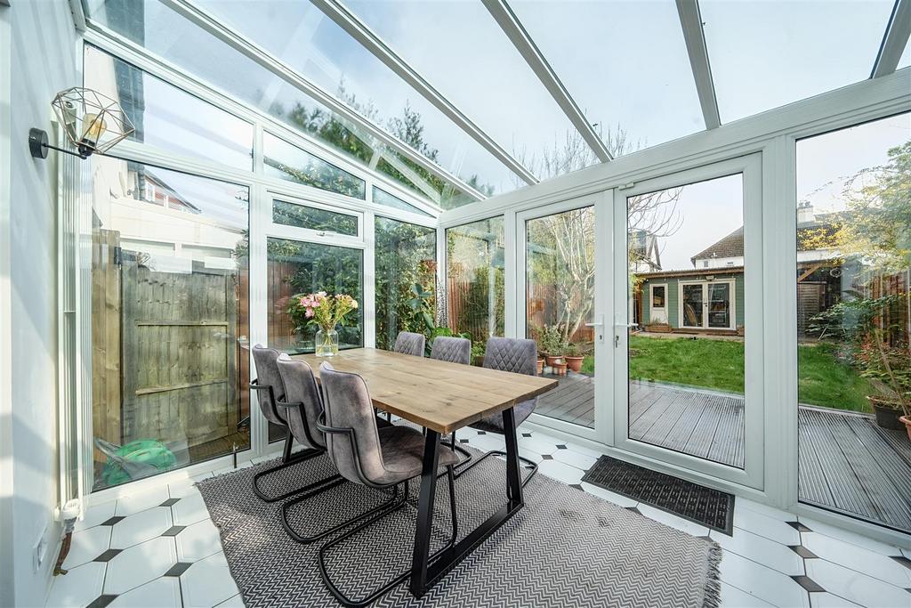 Conservatory interior, conservatory, french doors leading to garden