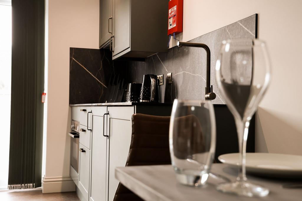 Stylish modern kitchen with marble splashback...