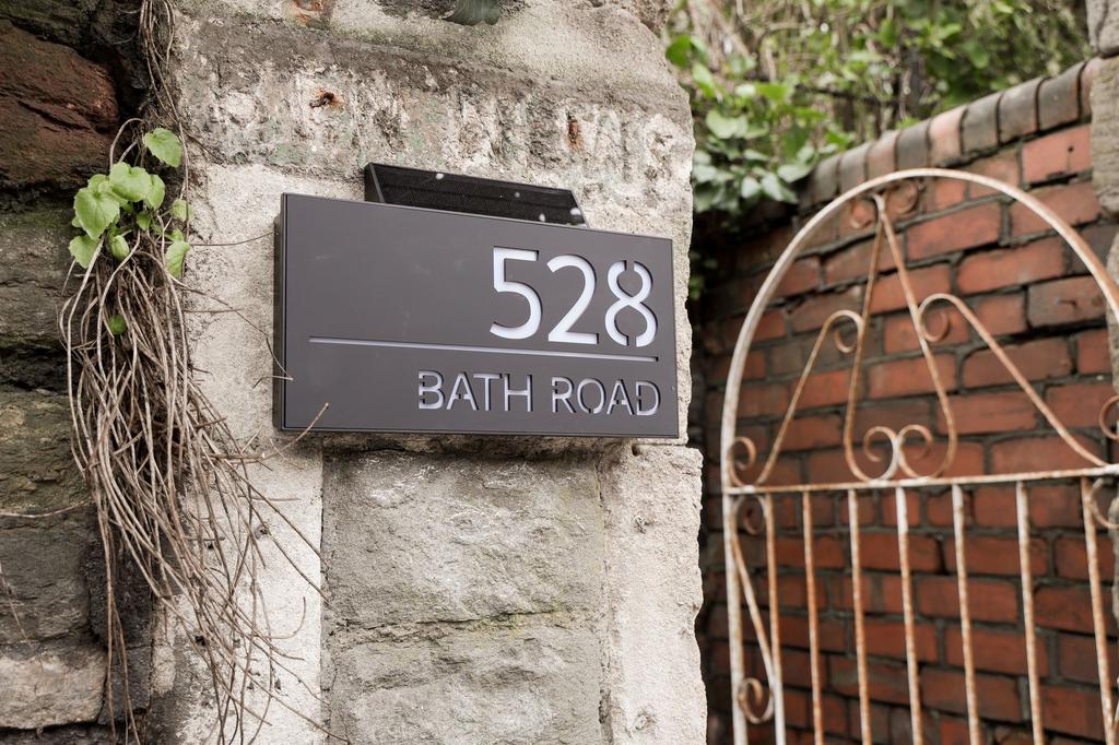 Stylish numbered entrance with decorative gate...