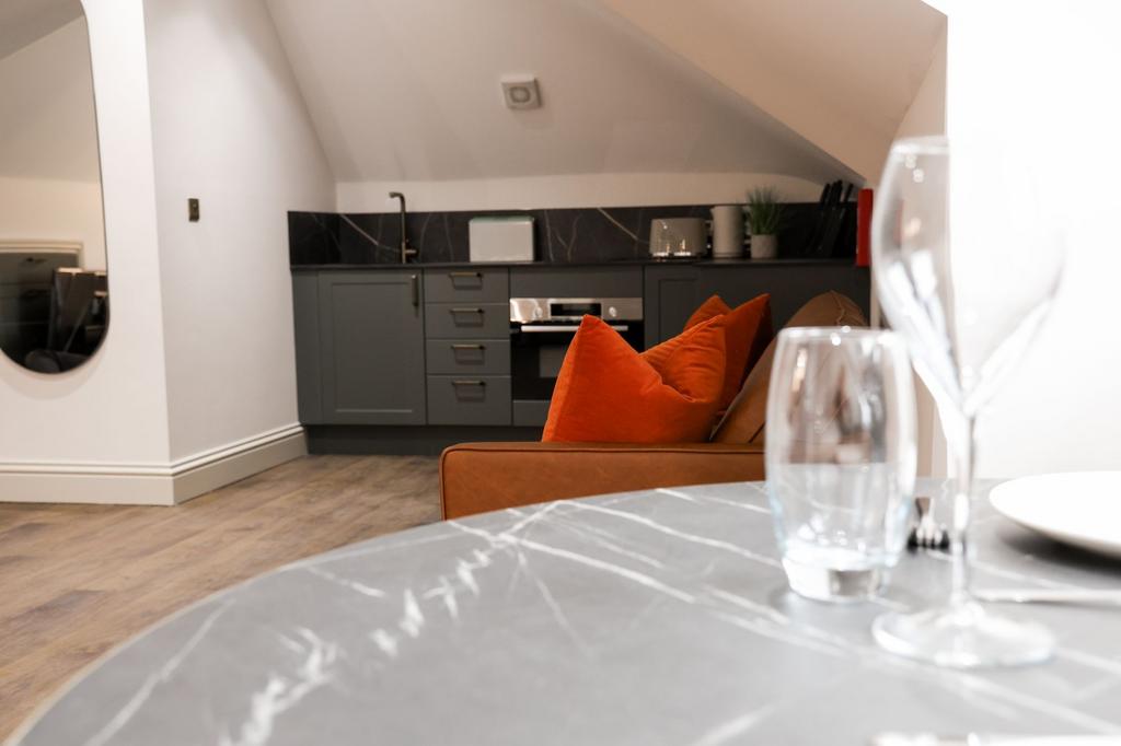 Stylish open-plan living area with modern kitch...