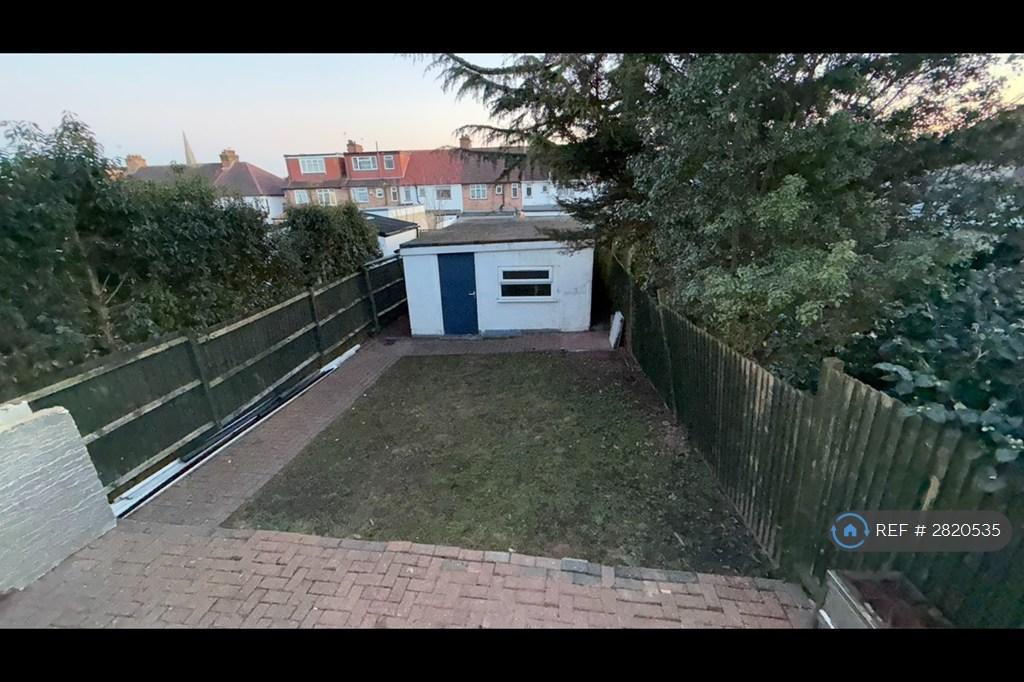 Rear Garden And Garage View