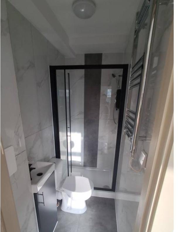 Modern tiled bathroom with walk-in shower...