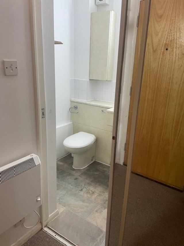 Compact, well-maintained bathroom with modern v...